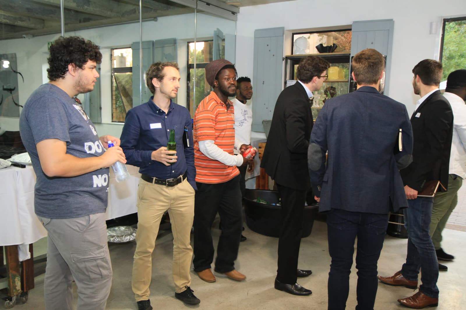 EthJoburg 1 — Early arrivals networking before the session opens.