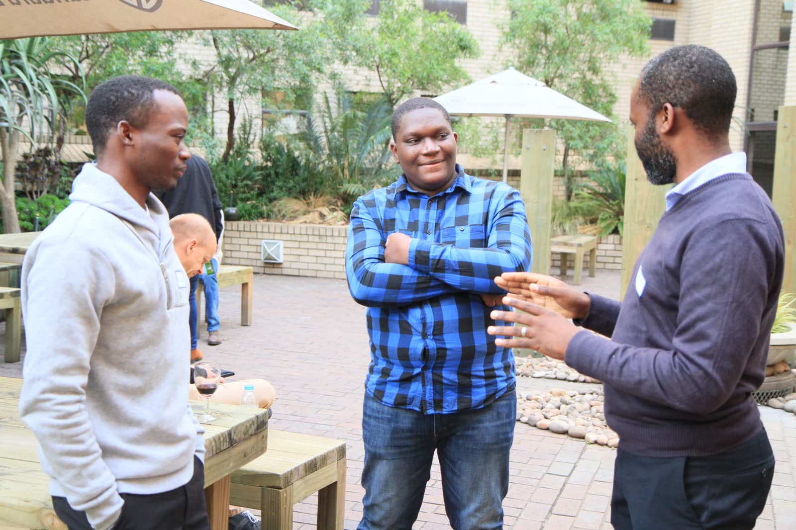 EthJoburg 1 — Developers and bankers in conversation in the courtyard.