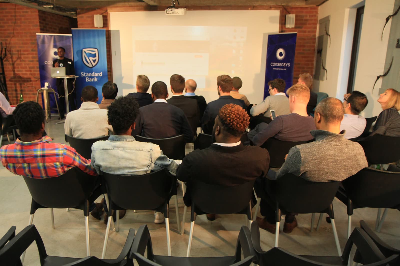 EthJoburg 1 — The room filling ahead of the opening presentation.